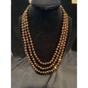 Vintage Necklace featuring bronze colored faceted crystal beads 64”